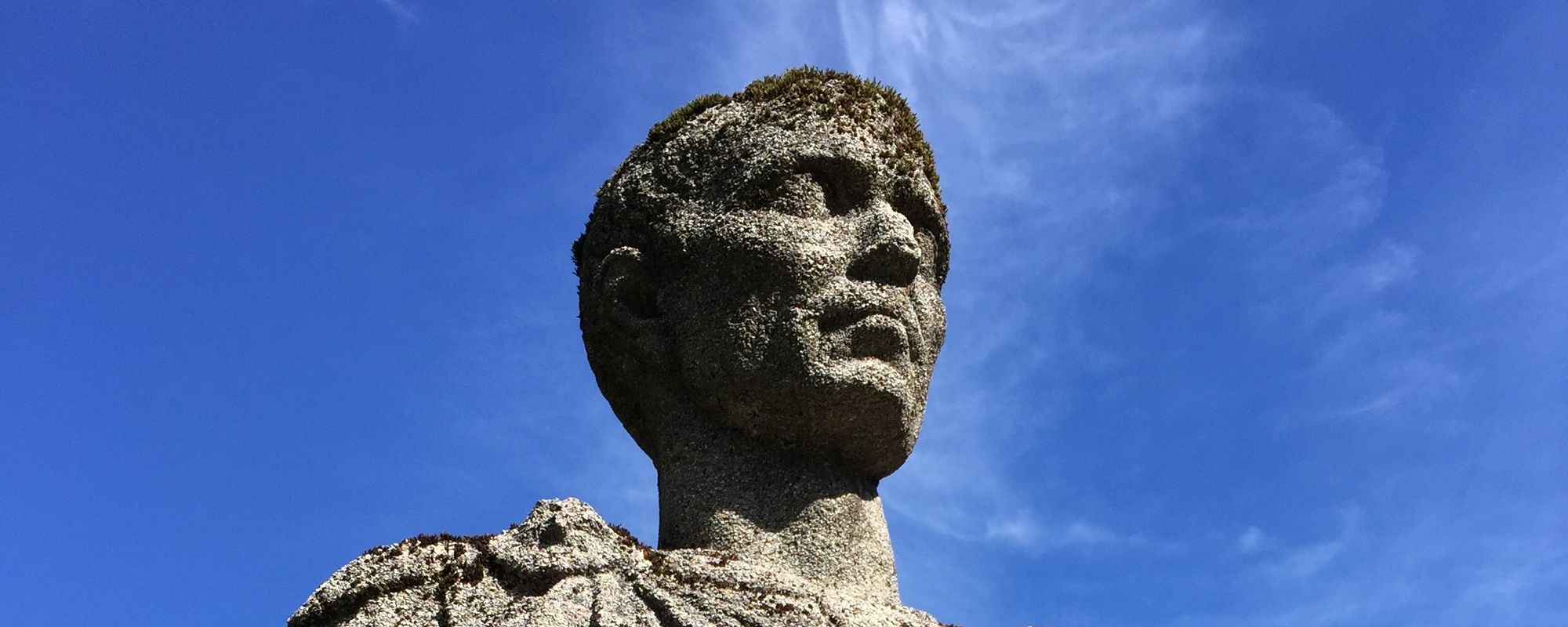 Upwards detail of a bust statue of a man