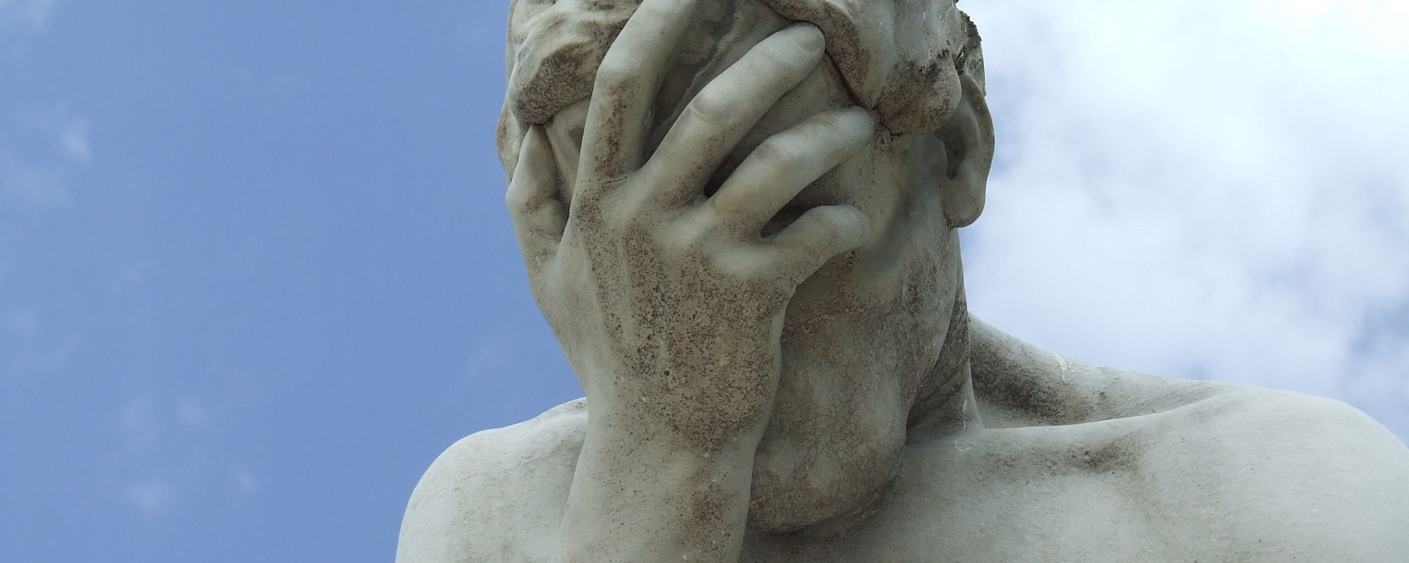 Statue depicting a facepalm