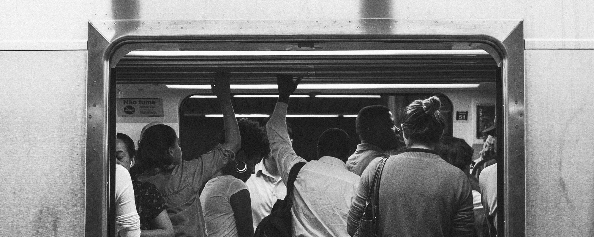 People crowding in a subway car