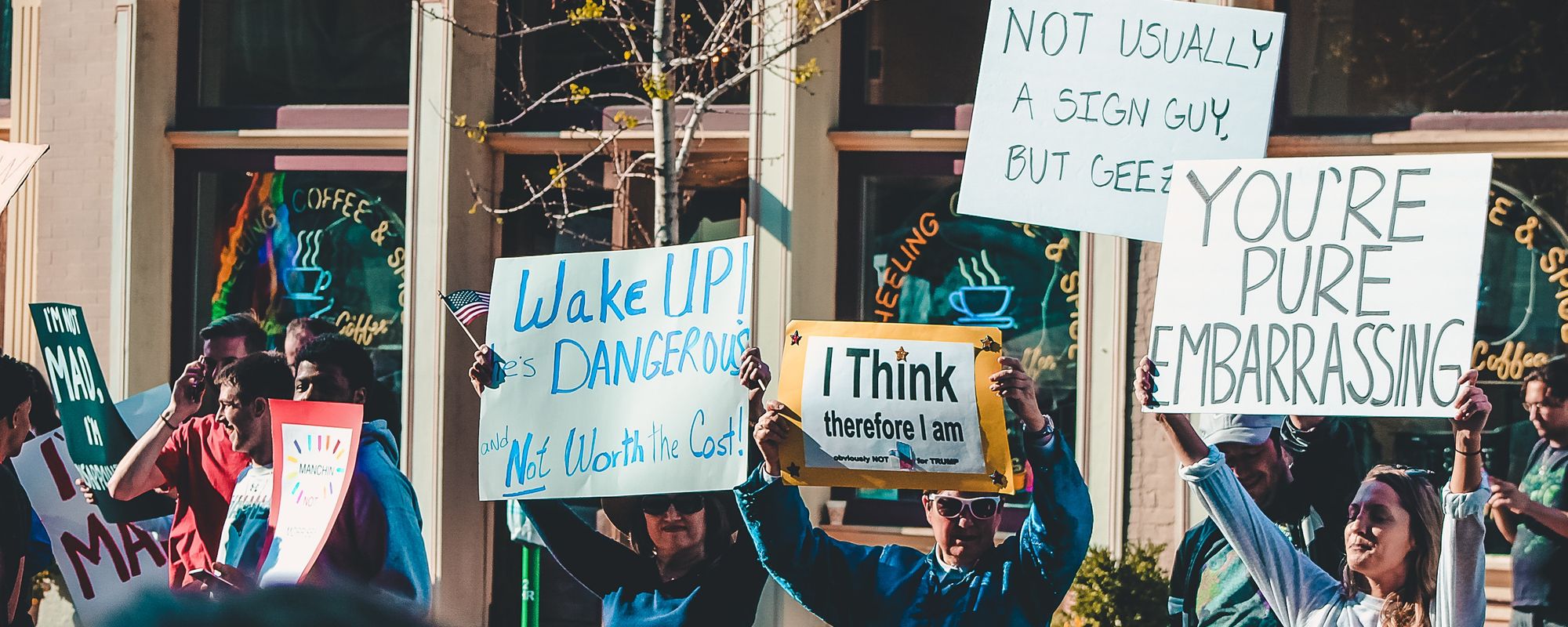 Some protesters holding funny signs